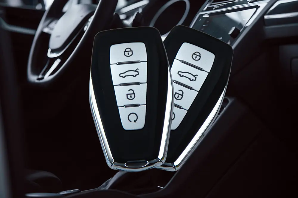 An image of two modern car keys.