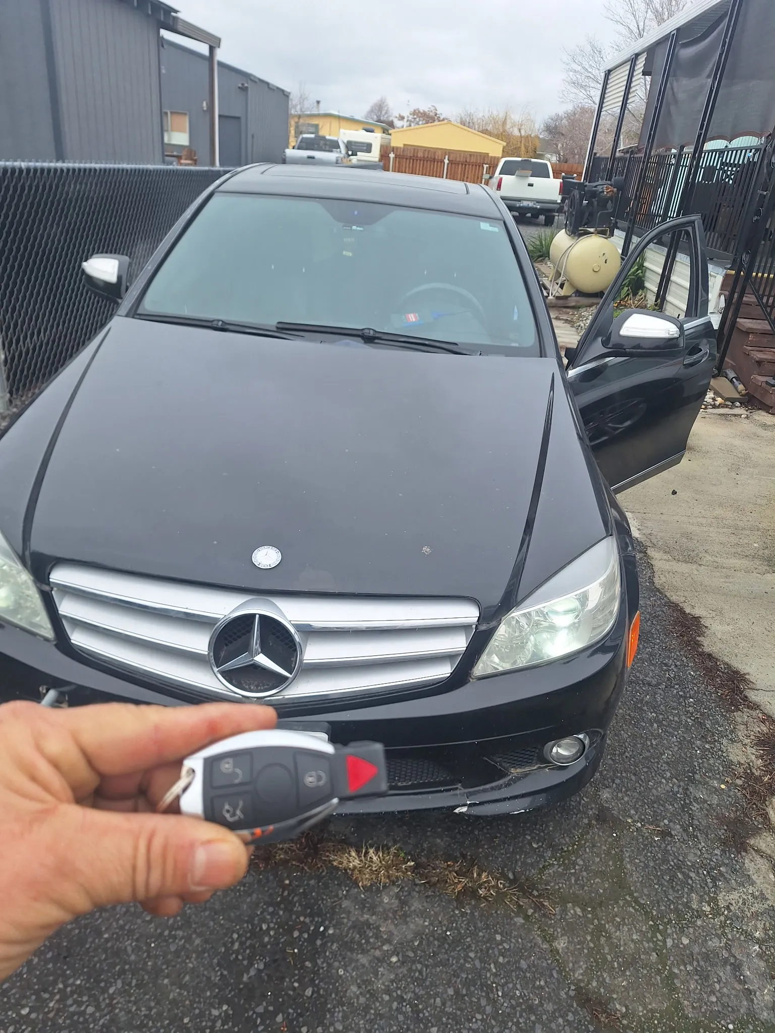 A key in front of a Mercedes-Benz.