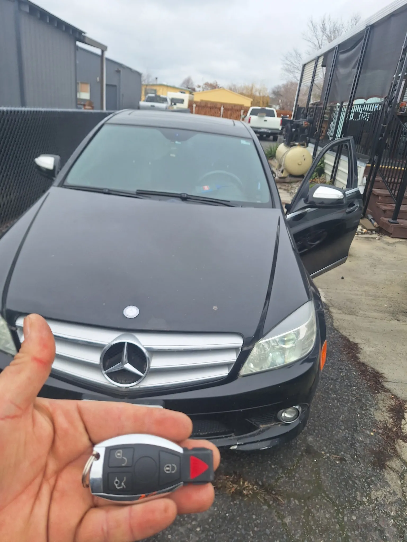 A key in front of a Mercedes-Benz.