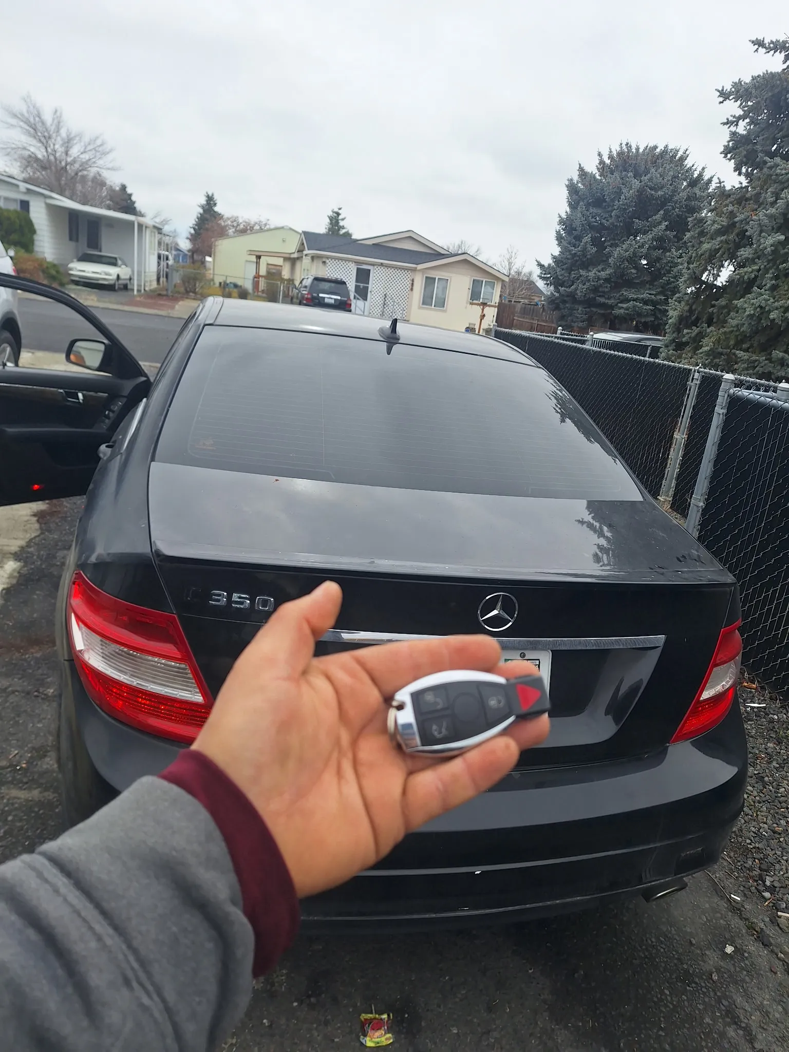 A key in front of a Mercedes-Benz.