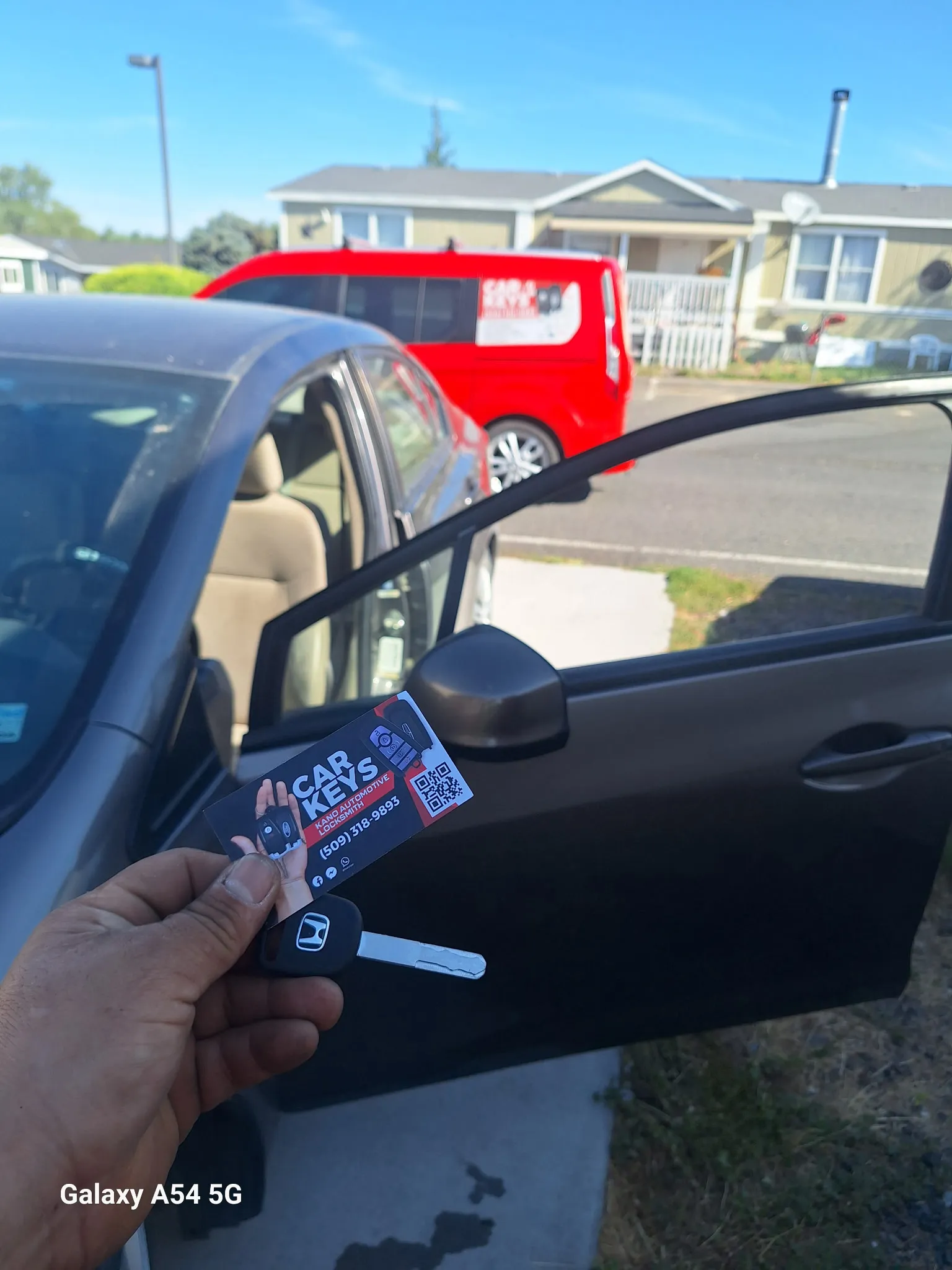 A car key next to the corresponding car.