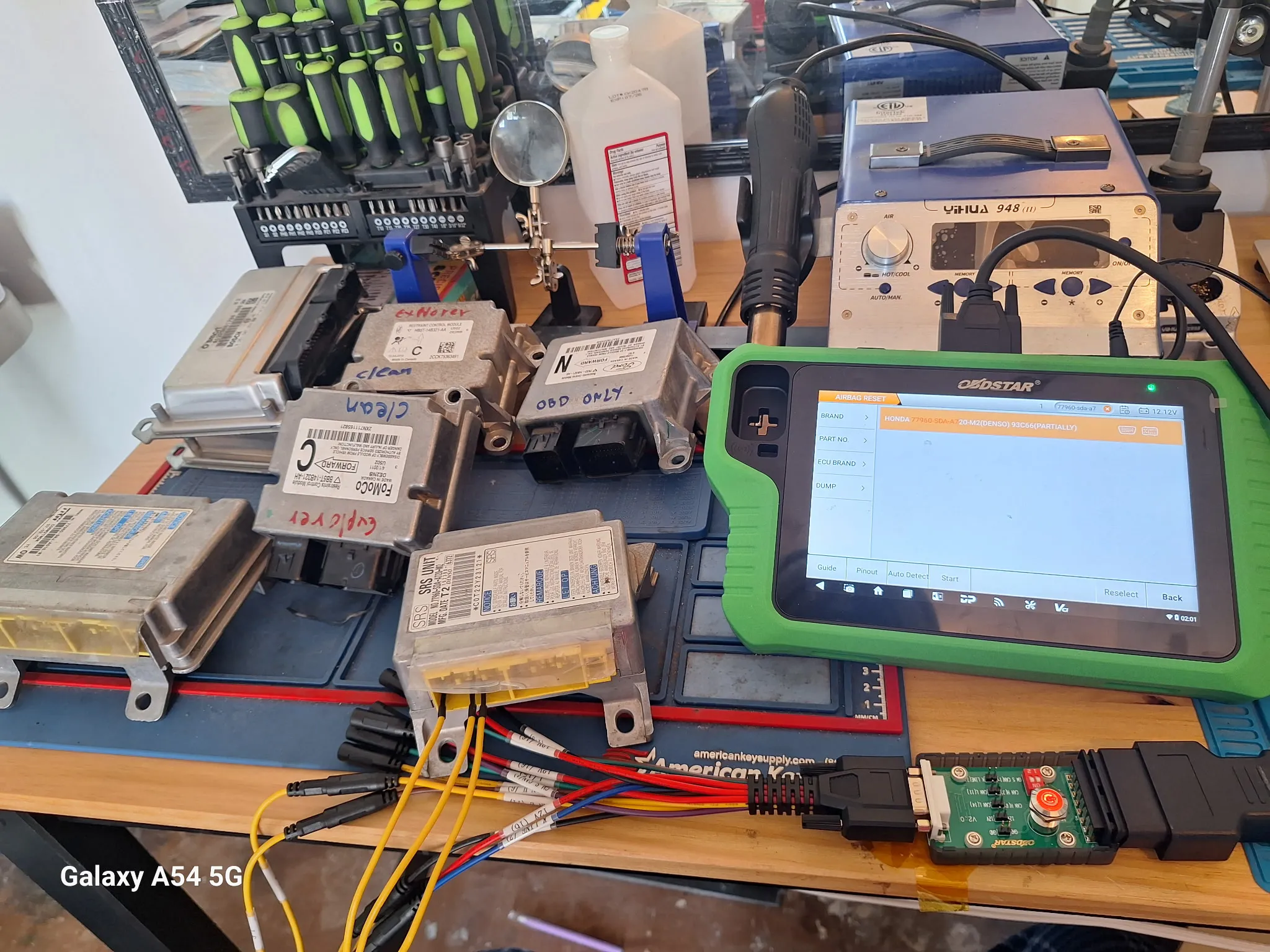 Airbag reset device next to many modules.